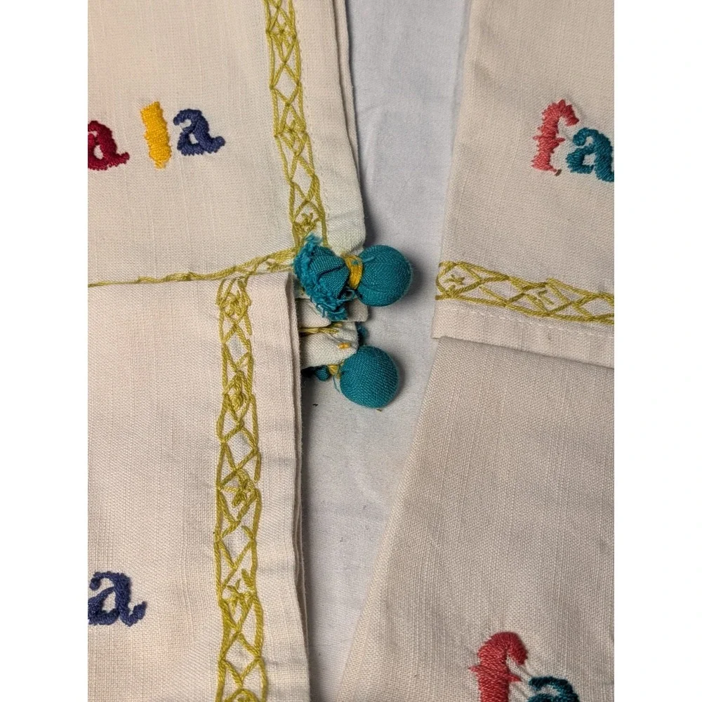 Set of 4 Fa La La Embroidered Christmas Napkins Cream with Teal Pom Tassels